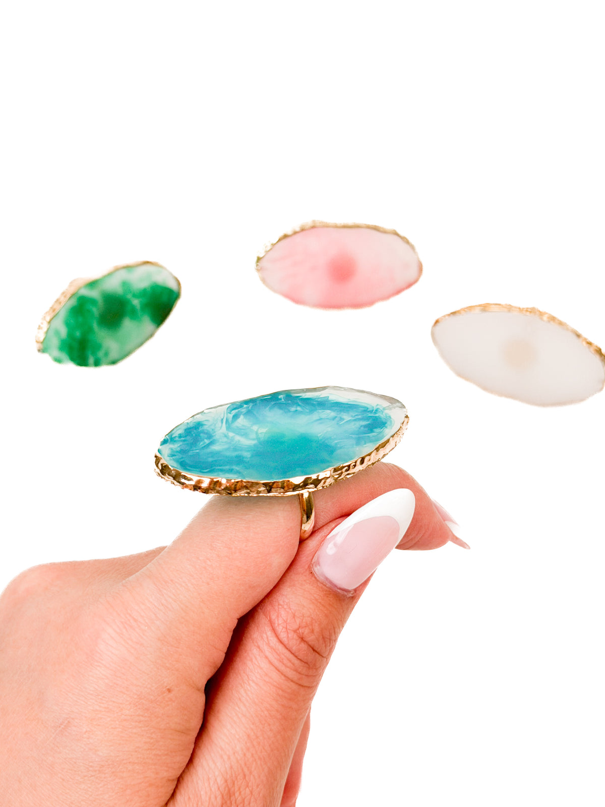 Mixing Palette Rings in four colors held in hand
