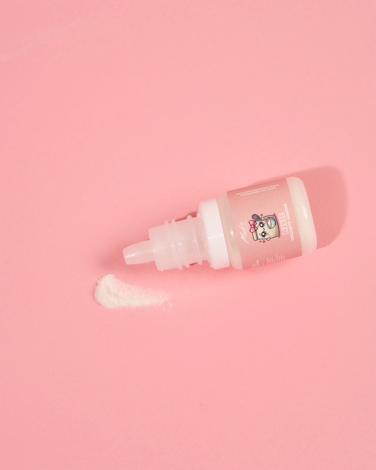 Mixie Viscosity Powder bottle on a pink background