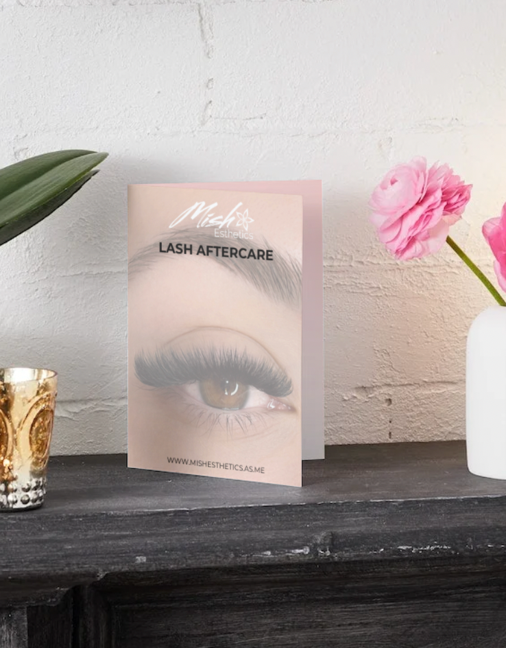 Lash Aftercare Card on a shelf with flowers